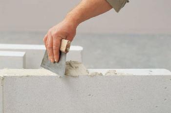 Three component and water based polyurethane adhesive for concrete formulations